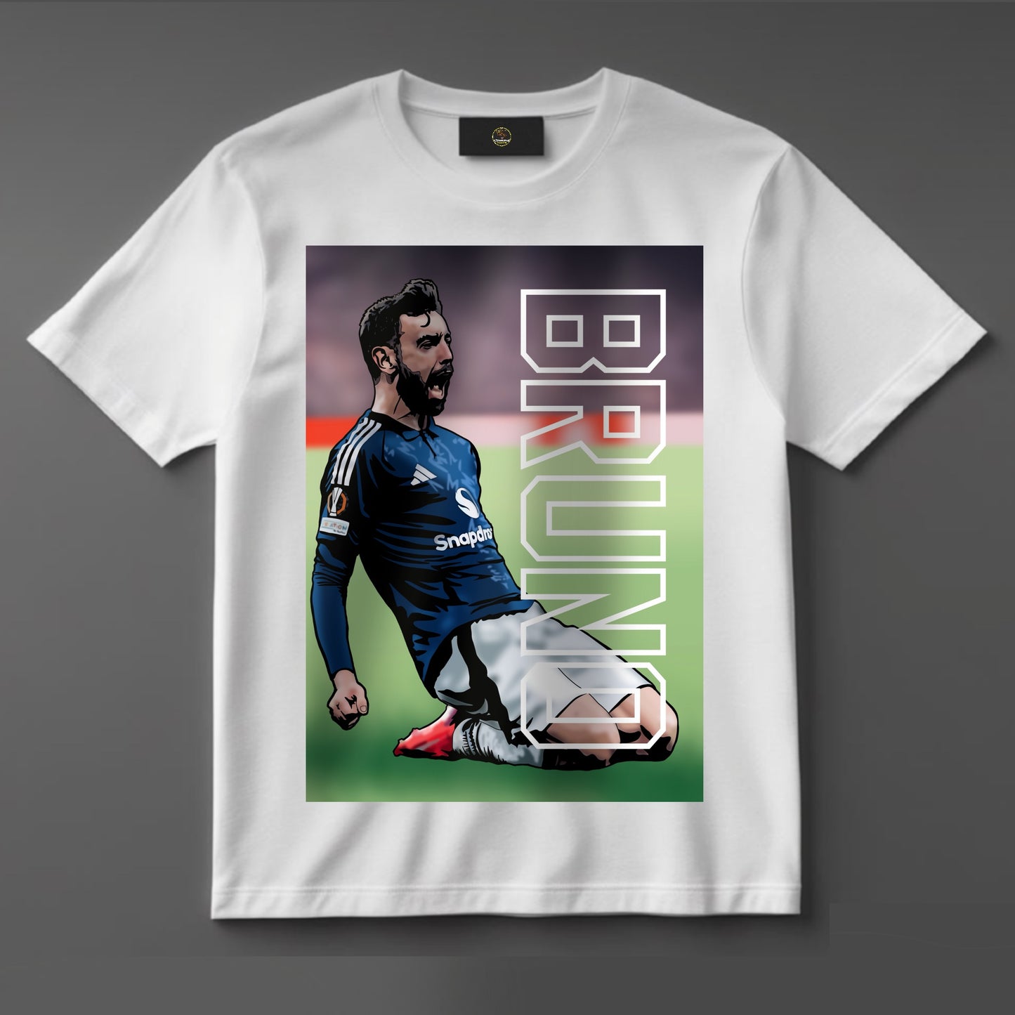 Black or white T-shirt featuring powerful artwork of Bruno Fernandes in full Manchester United kit, wearing the captain’s armband, with bold text like ‘United Hero’ — a must-have for loyal Red Devils fans.