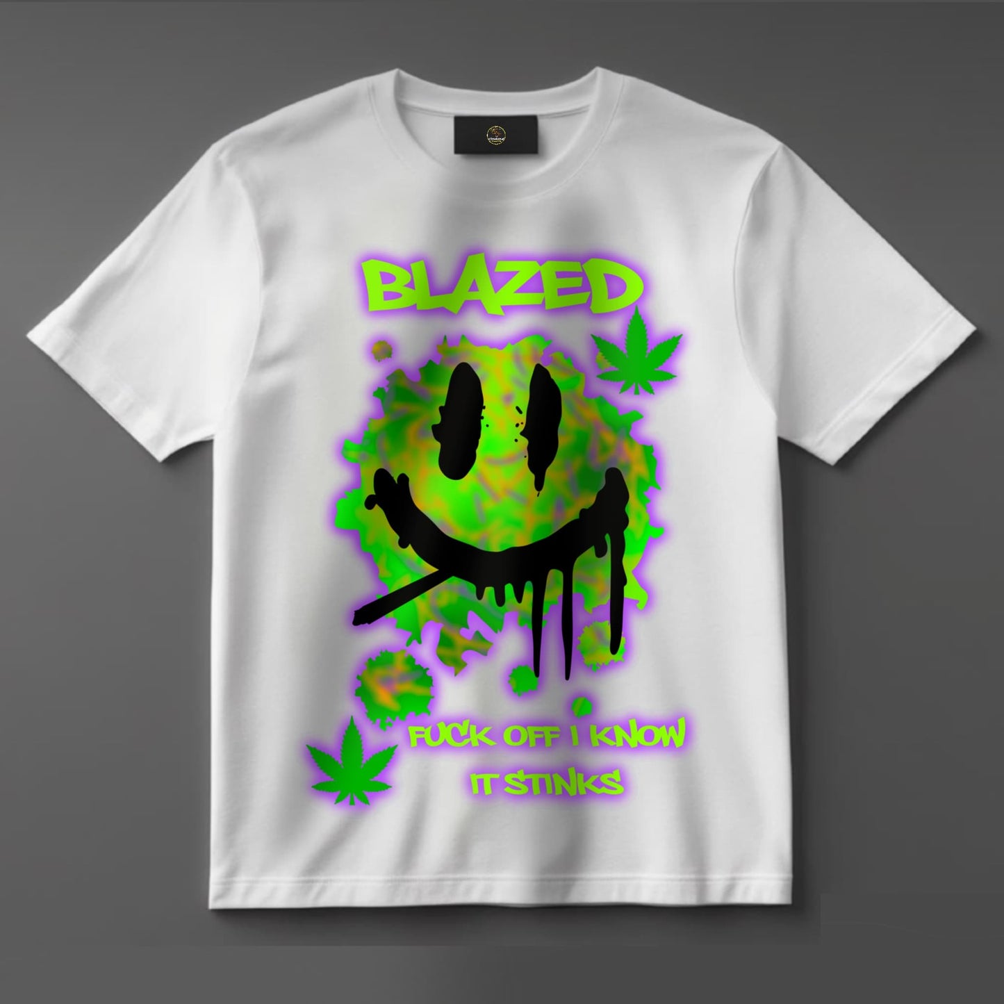 Black or white T-shirt with bold text reading ‘Blazed — Fuck Off, I Know It Stinks’ alongside cannabis-themed graphics — a loud, unapologetic statement piece for confident stoners.