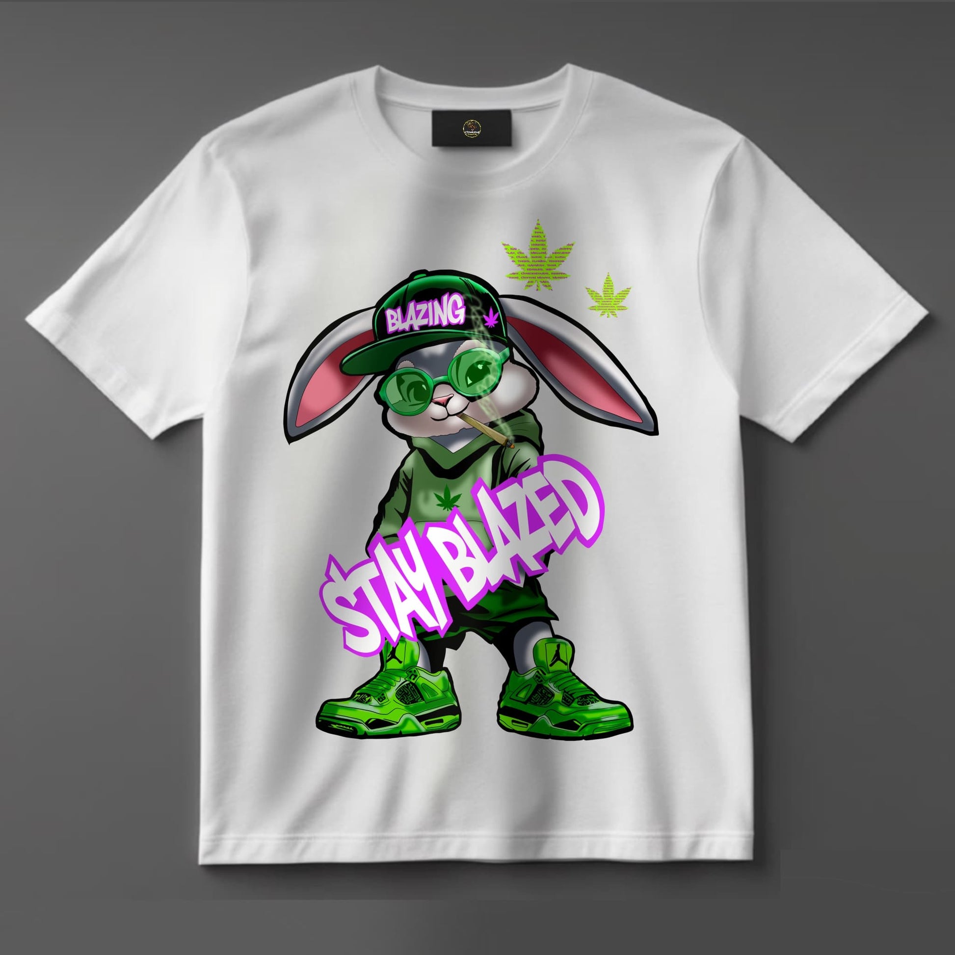 Black or white T-shirt featuring a laid-back cartoon rabbit with red eyes, puffing on a joint with smoke swirling around and the phrase ‘Stay Blazed’ — a fun, trippy design for cannabis lovers and stoner streetwear fans.