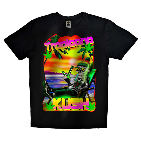 Black or white T-shirt featuring a chilled skeleton lounging on a tropical beach, smoking a spliff with palm trees and sun in the background, labeled ‘Tropicana Kush’ — a vibrant, laid-back design for weed lovers and beach vibes.