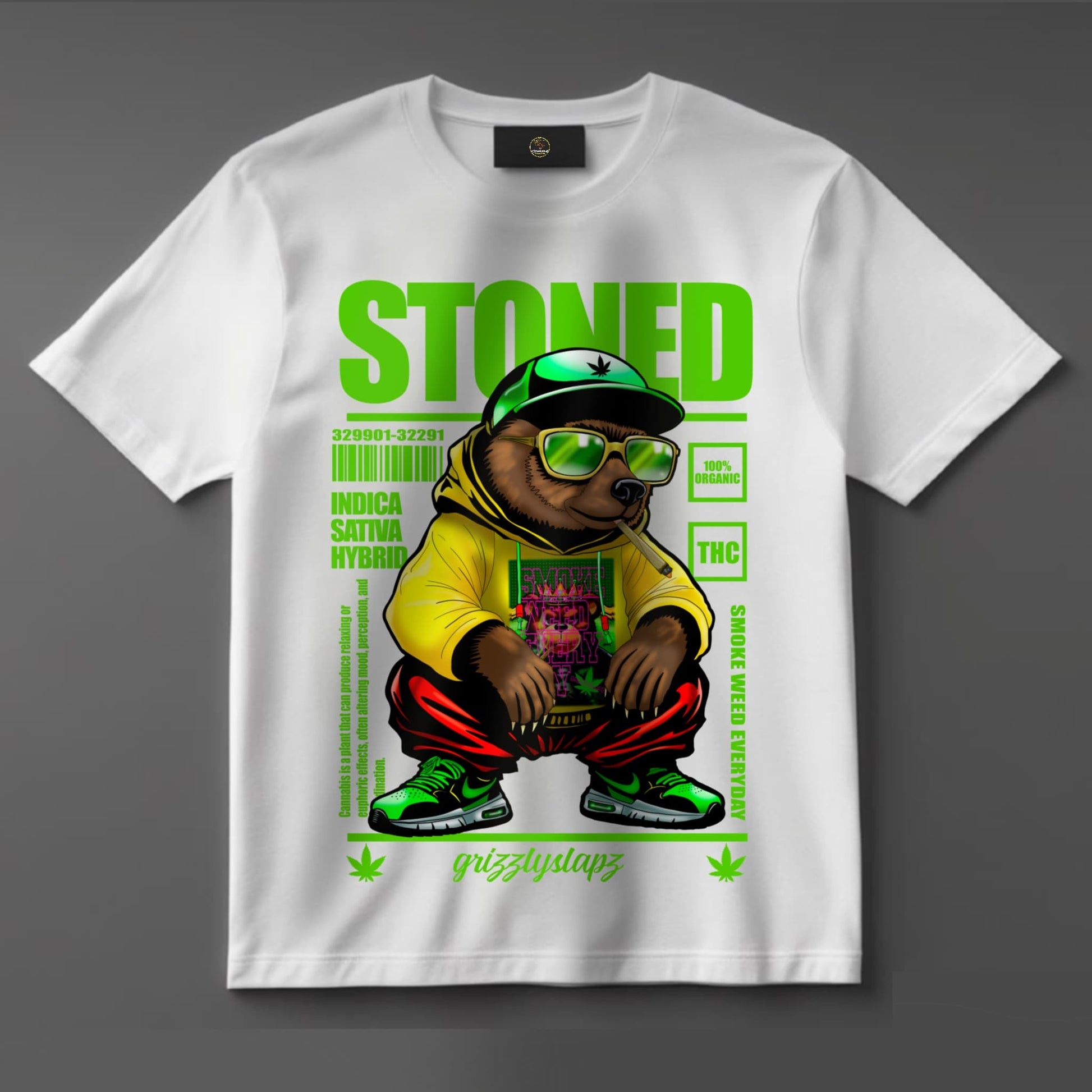 Black or white T-shirt featuring the signature GrizzlySlapz stoner bear with red eyes, holding a joint and surrounded by smoke and weed leaves — a fun, high-vibe design perfect for cannabis fans and streetwear lovers.